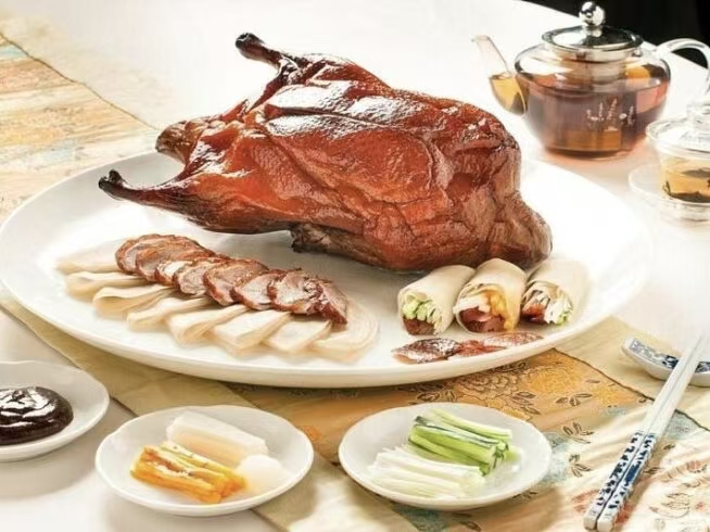 Slices of Beijing roast duck served on a plate